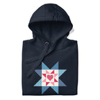 Liberty Love star quilt block with a heart in red, white and blue on a pullover hoodie in navy, folded close-up of the design – Kate Spain design for Pat Sloan
