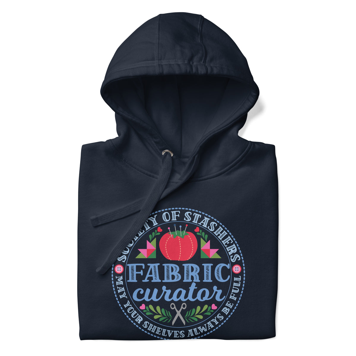 Fabric Curator Society of Stashers badge with a tomato pincushion on a pullover hoodie in navy, folded close-up of the design – Kate Spain design for Pat Sloan