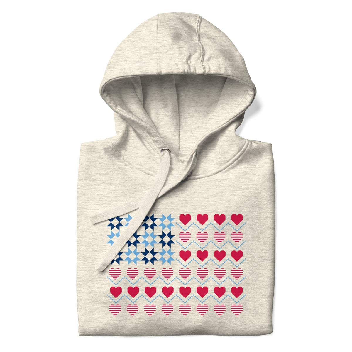 United We Quilt patchwork flag with quilt-block stars and heart stripes on a pullover hoodie in natural heather, folded close-up of the design – Kate Spain design for Pat Sloan