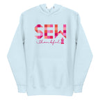 Sew Thankful patchwork lettering with a heart-topped thread spool on a pullover hoodie in sky blue, front view – Kate Spain design for Pat Sloan