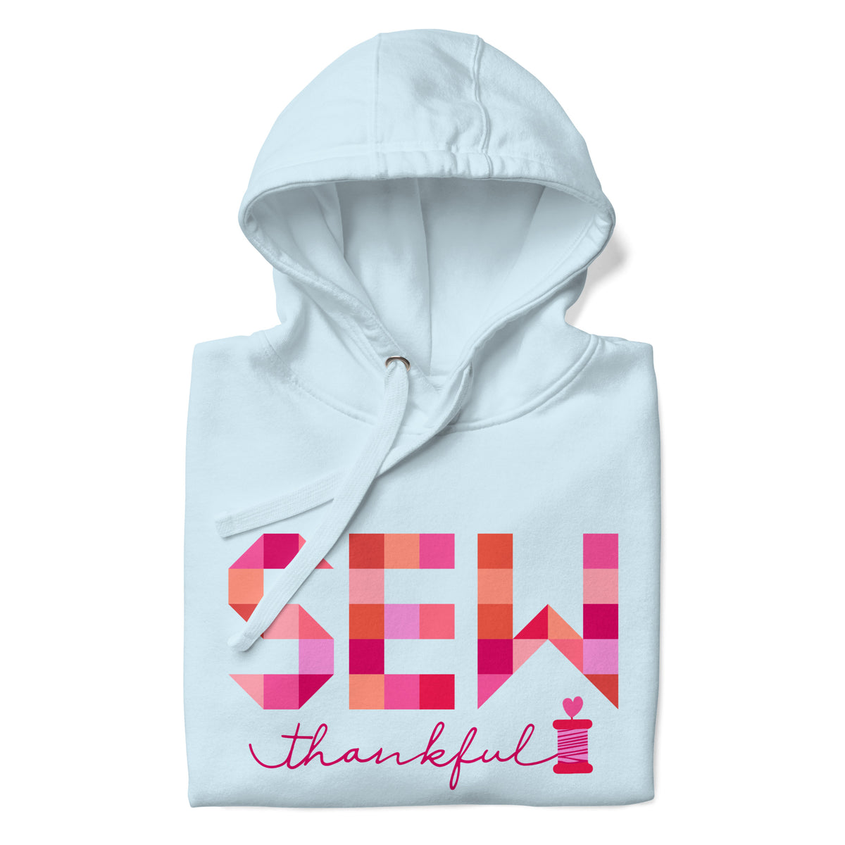 Sew Thankful patchwork lettering with a heart-topped thread spool on a pullover hoodie in sky blue, folded close-up of the design – Kate Spain design for Pat Sloan