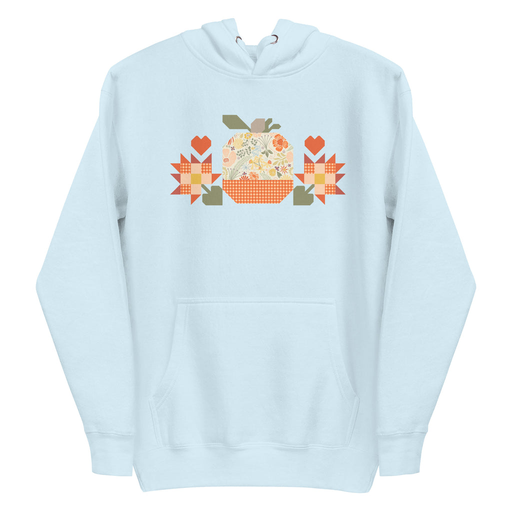 Falling for Fall patchwork pumpkin with quilt-block stars and hearts on a pullover hoodie in sky blue, front view – Kate Spain design for Pat Sloan