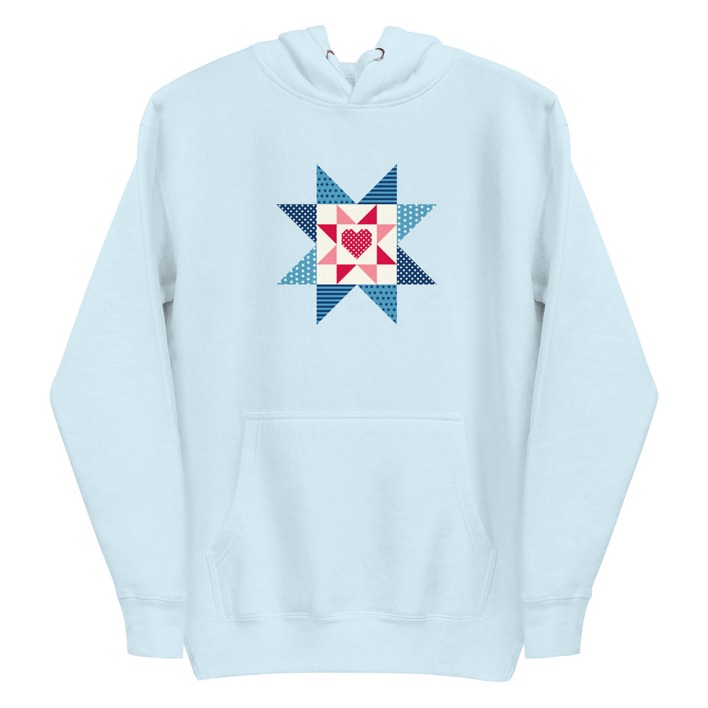 Liberty Love star quilt block with a heart in red, white and blue on a pullover hoodie in sky blue, front view – Kate Spain design for Pat Sloan
