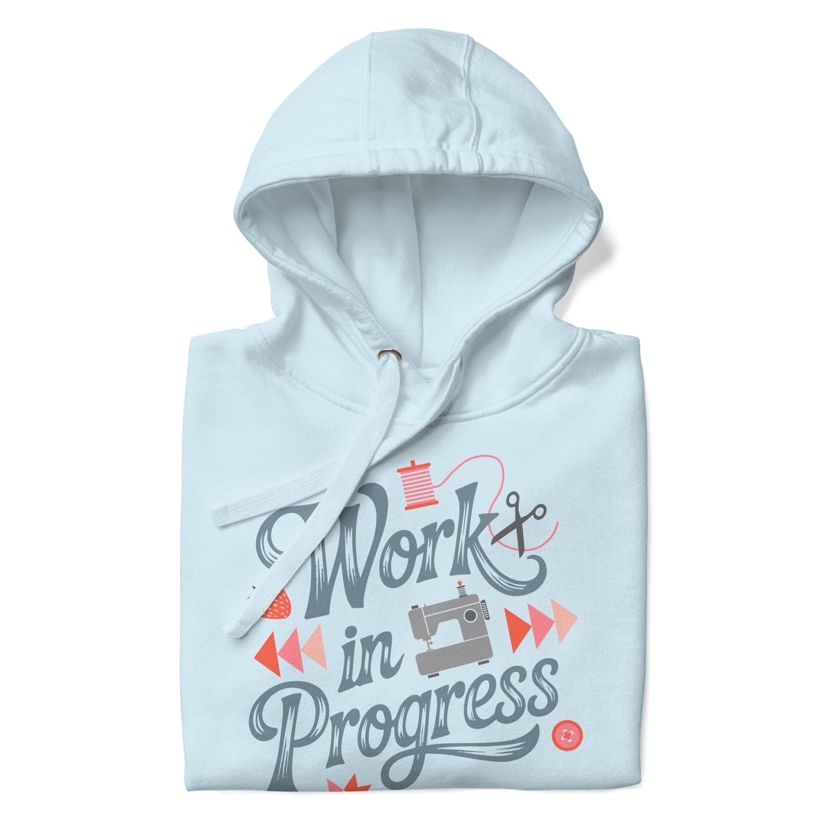 Work in Progress sewing design with flying geese, sewing machine, strawberry and thread spool on a pullover hoodie in sky blue, folded close-up of the design – Kate Spain design for Pat Sloan