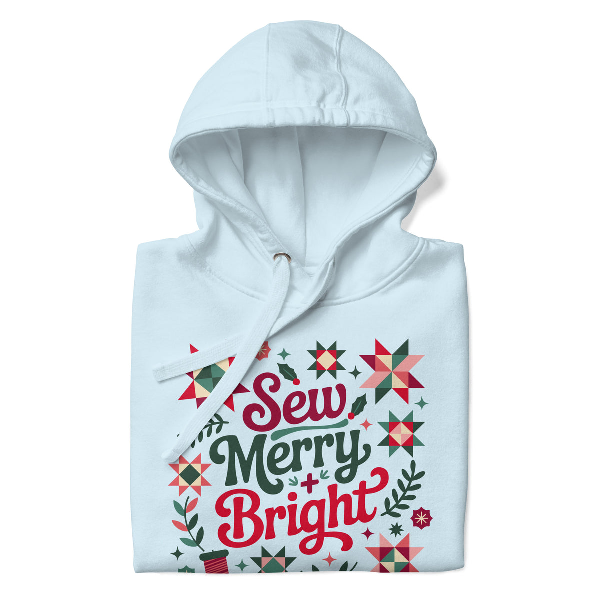 Sew Merry + Bright lettering with quilt-block stars, holly and a thread spool on a pullover hoodie in sky blue, folded close-up of the design – Kate Spain design for Pat Sloan