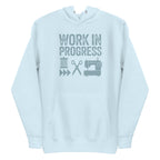 Work in Progress Mod distressed lettering with thread, scissors and sewing machine on a pullover hoodie in sky blue, front view – Kate Spain design for Pat Sloan