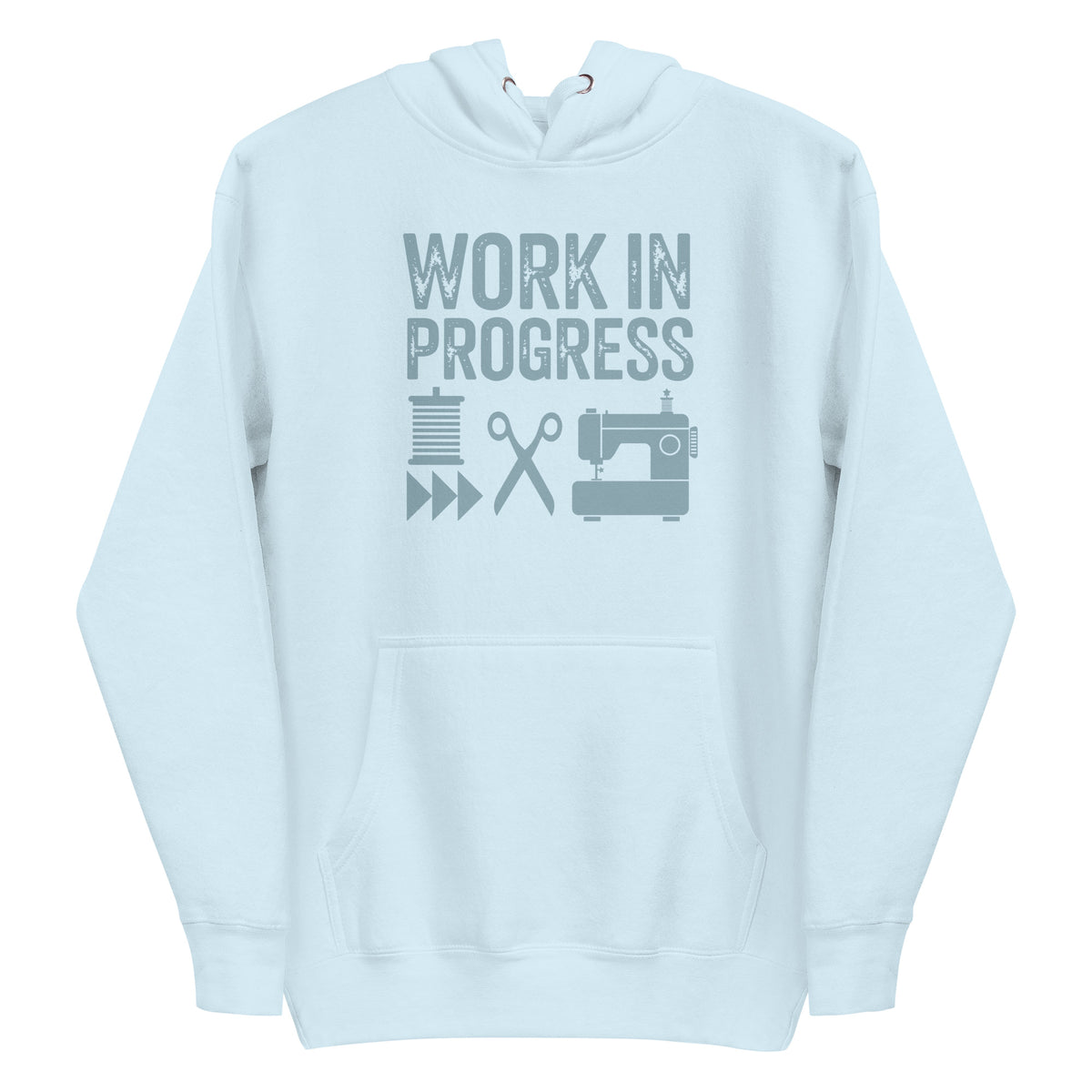 Work in Progress Mod distressed lettering with thread, scissors and sewing machine on a pullover hoodie in sky blue, front view – Kate Spain design for Pat Sloan