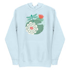 Dragonfly over water lilies and lily pads on a pullover hoodie in sky blue, front view – Kate Spain design