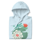 Dragonfly over water lilies and lily pads on a pullover hoodie in sky blue, folded close-up of the design – Kate Spain design