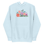 Bloom woodblock-style flowers with a butterfly, ladybug and bee on a pullover hoodie in sky blue, front view – Kate Spain design