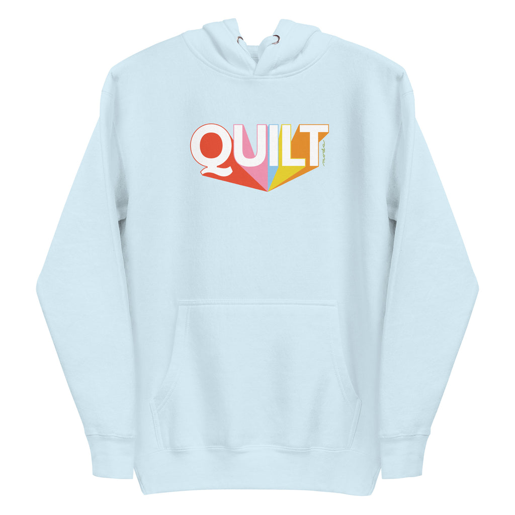 Moda QUILT logo with orange, pink, blue and yellow rays on a premium hoodie in sky blue, front view – Kate Spain design