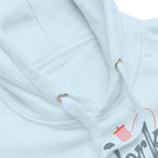 Work in Progress sewing design with flying geese, sewing machine, strawberry and thread spool on a pullover hoodie in sky blue, close-up of the hood and print – Kate Spain design for Pat Sloan