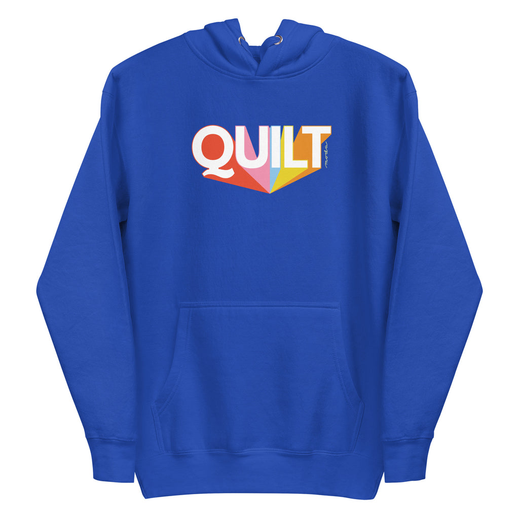 Moda QUILT logo with orange, pink, blue and yellow rays on a premium hoodie in royal blue, front view – Kate Spain design