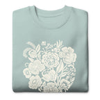 Meadowsweet woodblock-style bouquet of wildflowers on a crewneck sweatshirt in agave, folded close-up of the design – Kate Spain design
