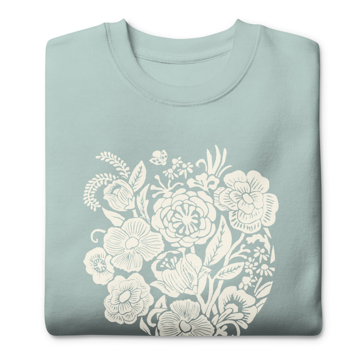 Meadowsweet woodblock-style bouquet of wildflowers on a crewneck sweatshirt in agave, folded close-up of the design – Kate Spain design