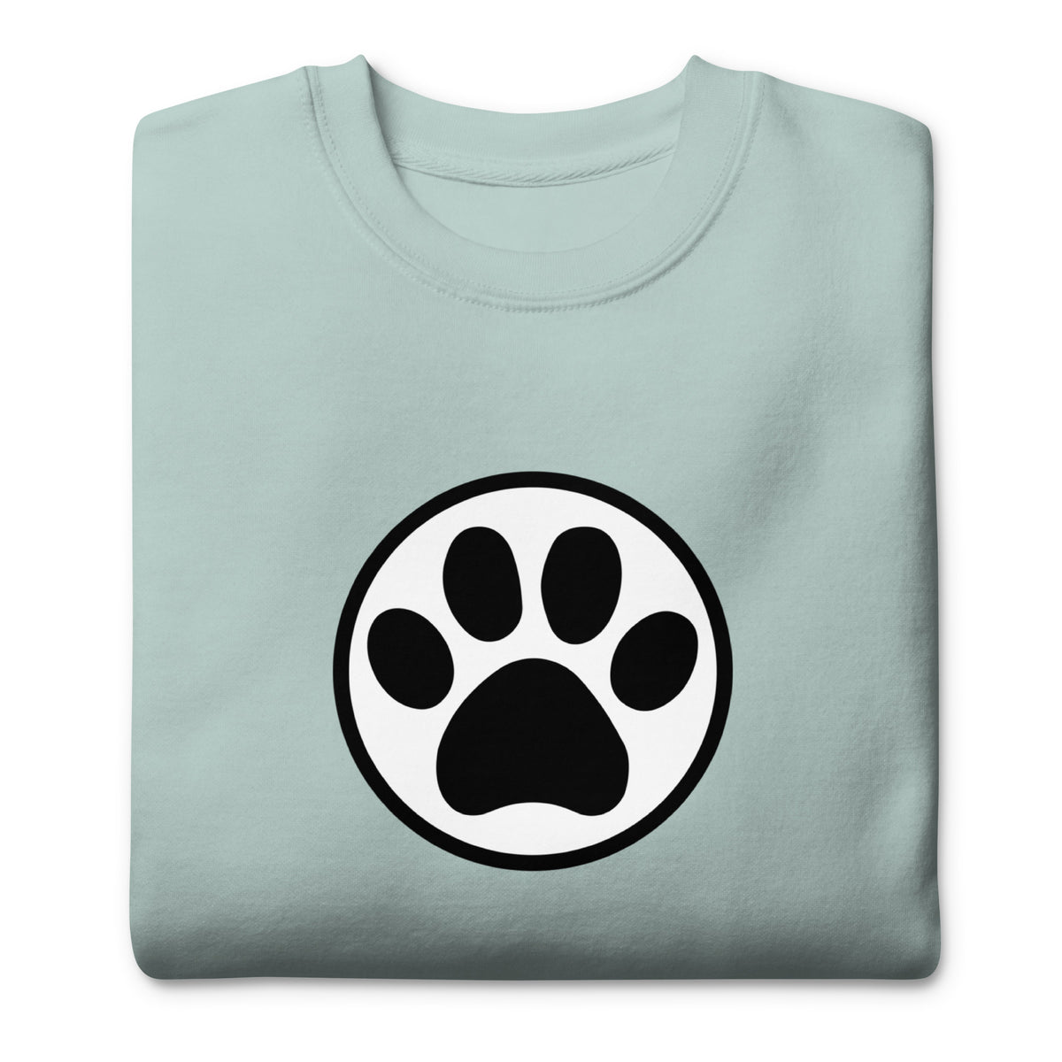 Law of the Paw® cat paw print on a crewneck sweatshirt in agave, folded close-up of the design – Kate Spain design