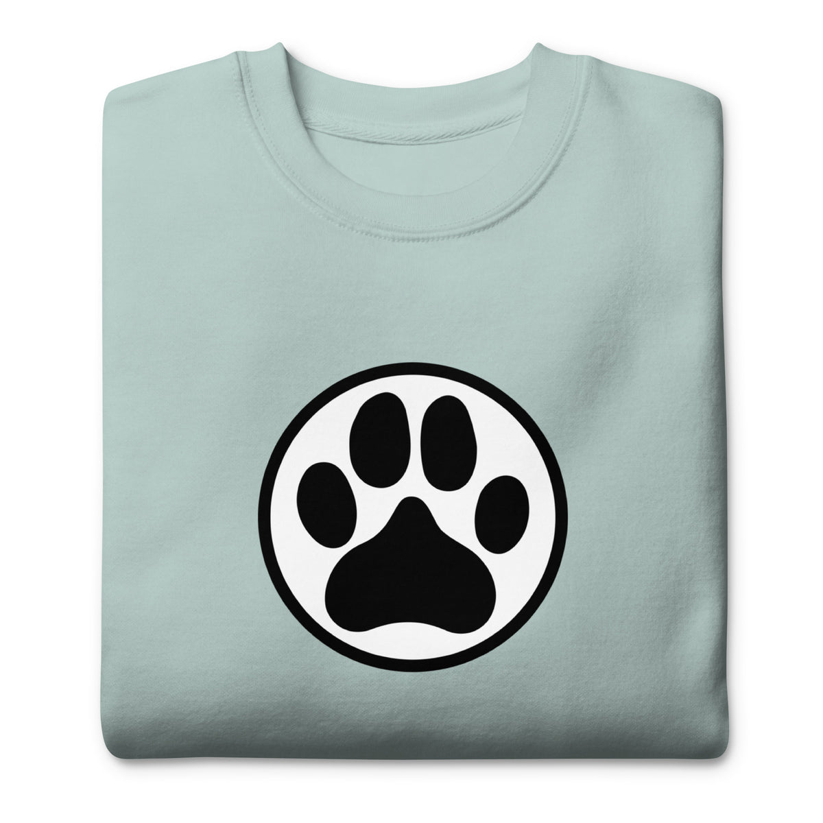 Law of the Paw® dog paw print on a crewneck sweatshirt in agave, folded close-up of the design – Kate Spain design