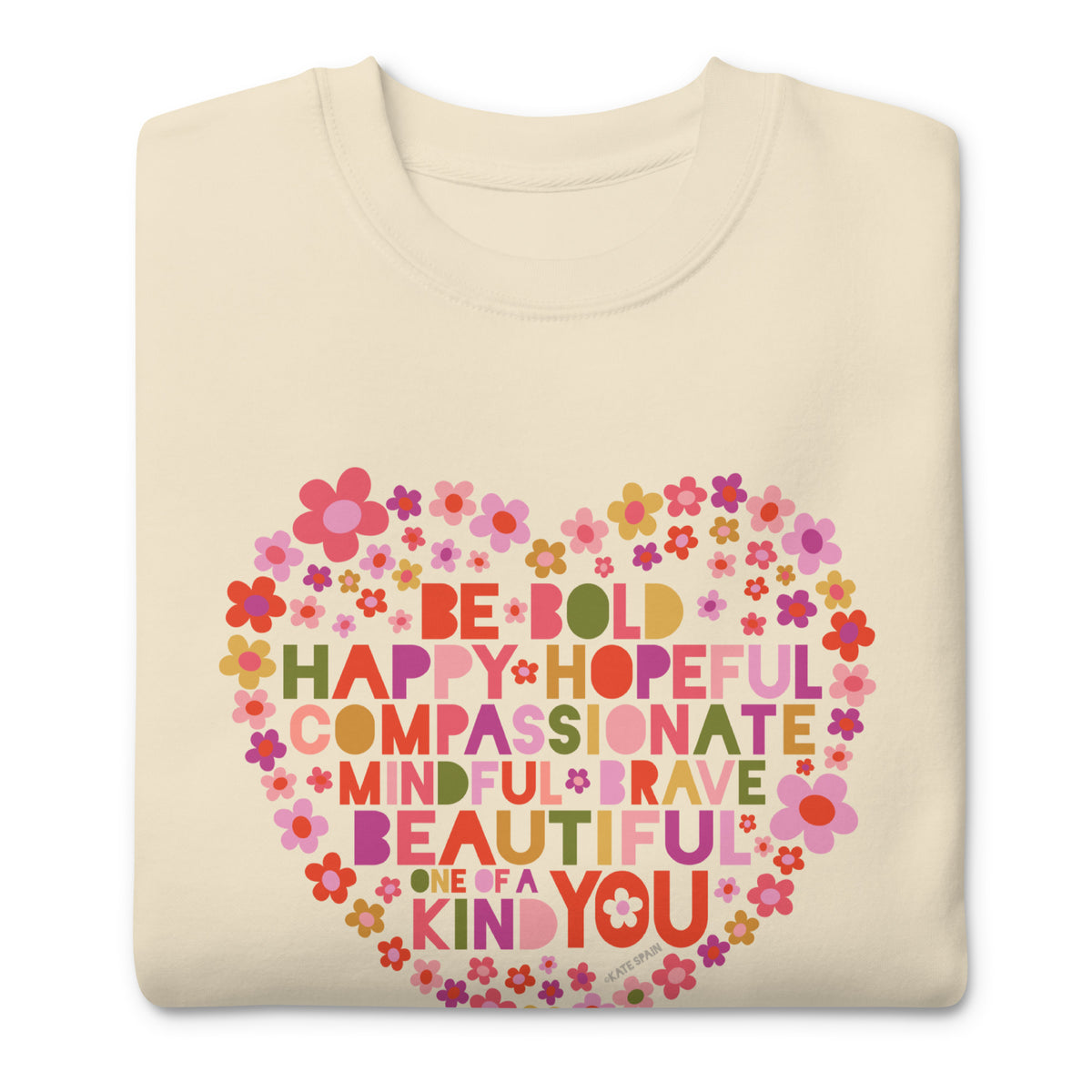 Be You floral heart of inspirational words on a premium sweatshirt in vintage white, folded close-up of the design – Kate Spain design