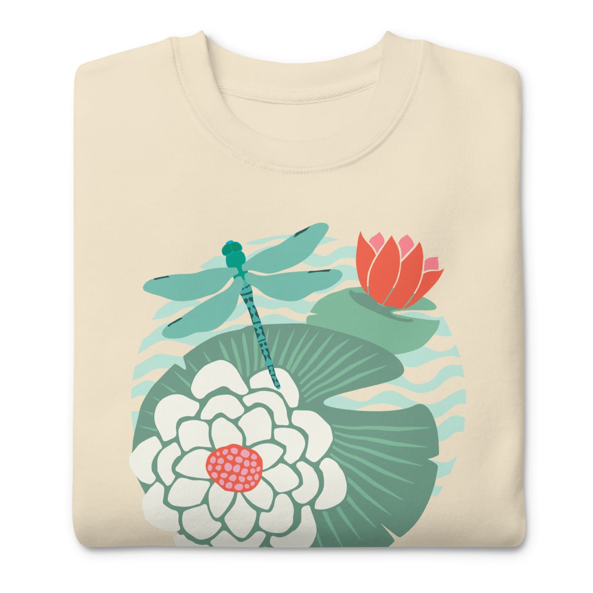 Dragonfly over water lilies and lily pads on a crewneck sweatshirt in vintage white, folded close-up of the design – Kate Spain design