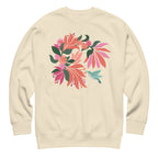Hummingbird among coral tropical flowers on a crewneck sweatshirt in vintage white, front view – Kate Spain design