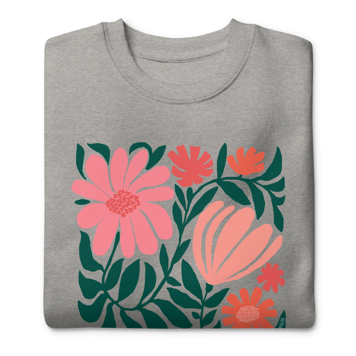 Botanica modern floral design with pink and coral blooms on a crewneck sweatshirt in athletic grey, folded close-up of the design – Kate Spain design