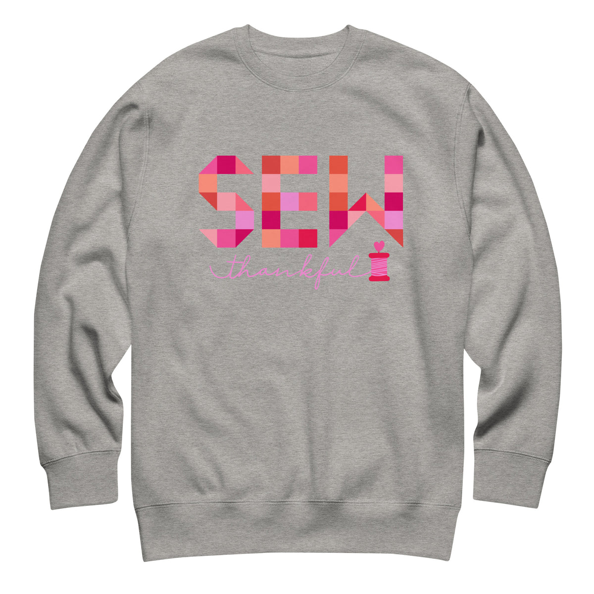 Sew Thankful patchwork lettering with a heart-topped thread spool on a crewneck sweatshirt in athletic grey, front view – Kate Spain design for Pat Sloan