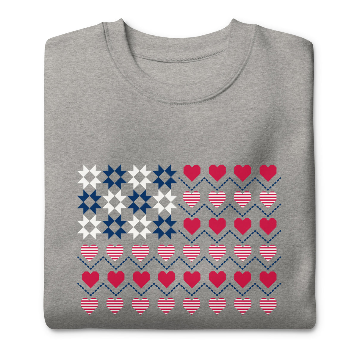 United We Quilt patchwork flag with quilt-block stars and heart stripes on a crewneck sweatshirt in athletic grey, folded close-up of the design – Kate Spain design for Pat Sloan
