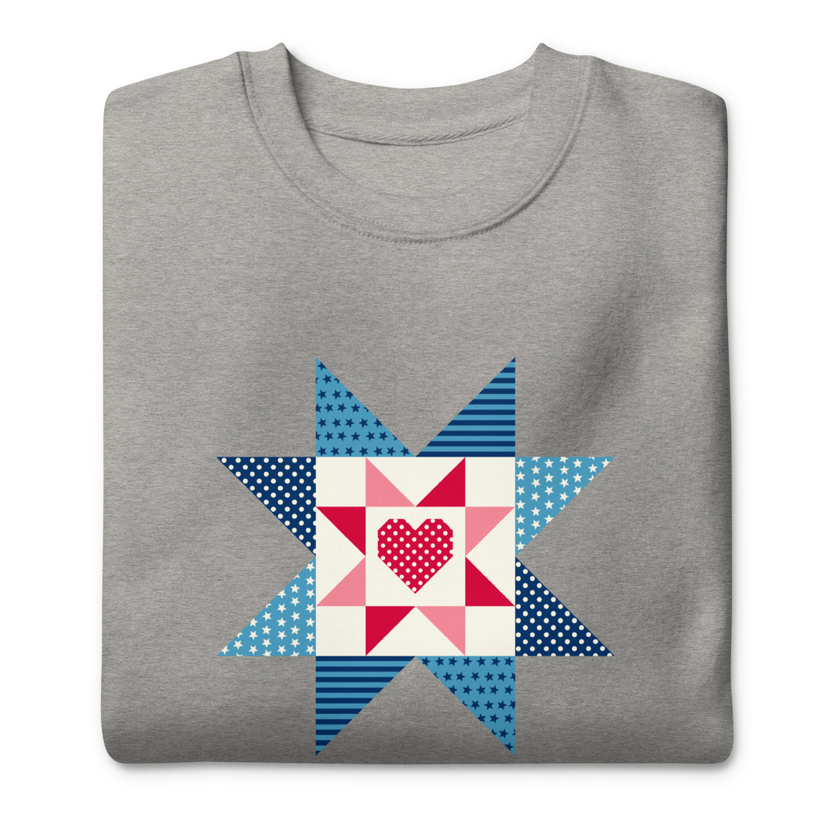 Liberty Love star quilt block with a heart in red, white and blue on a crewneck sweatshirt in athletic grey, folded close-up of the design – Kate Spain design for Pat Sloan