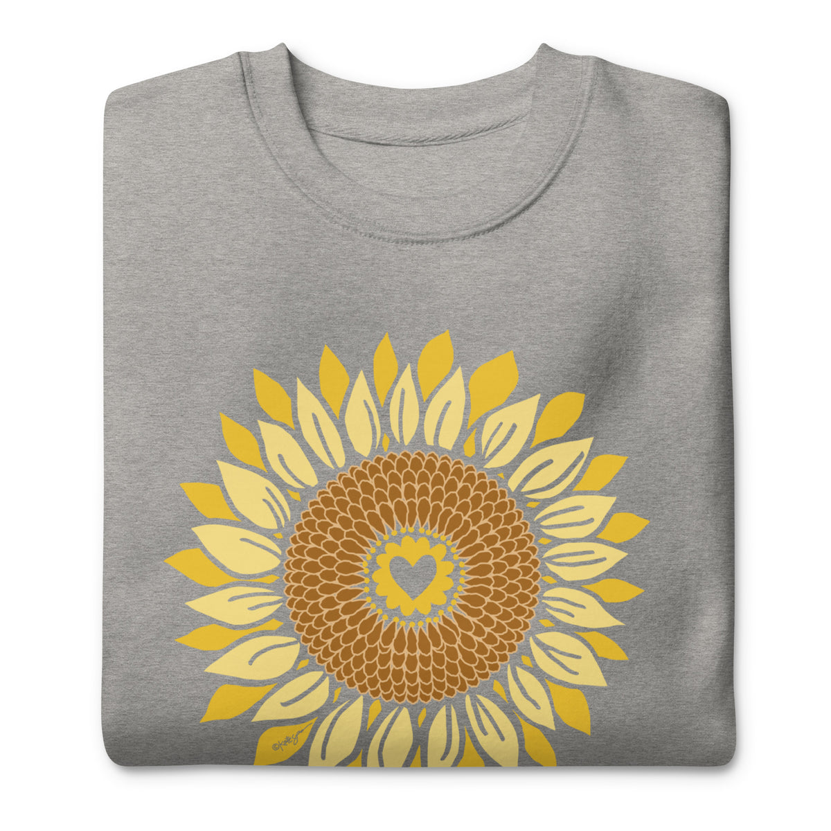 Golden sunflower with a heart center on a crewneck sweatshirt in athletic grey, folded close-up of the design – Sunflowers in My Heart by Kate Spain