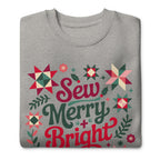 Sew Merry + Bright lettering with quilt stars and holly on a premium sweatshirt in athletic grey, folded close-up of the design – Kate Spain design for Pat Sloan