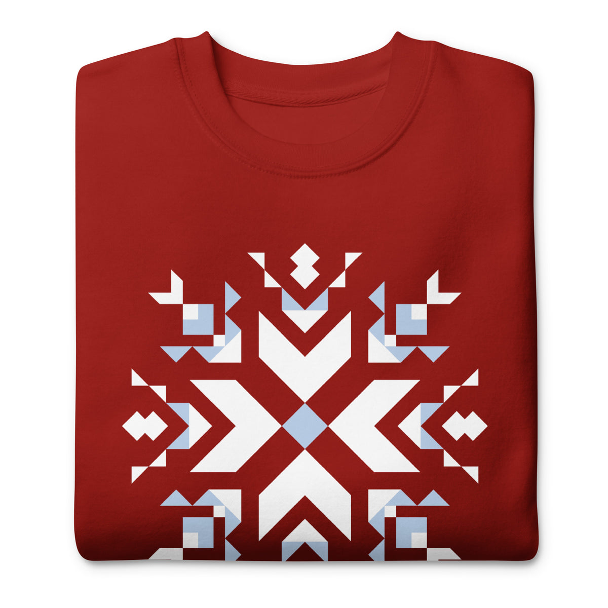 Let It Snow snowflake quilt block on a crewneck sweatshirt in cardinal red, folded close-up of the design – Kate Spain design for Pat Sloan