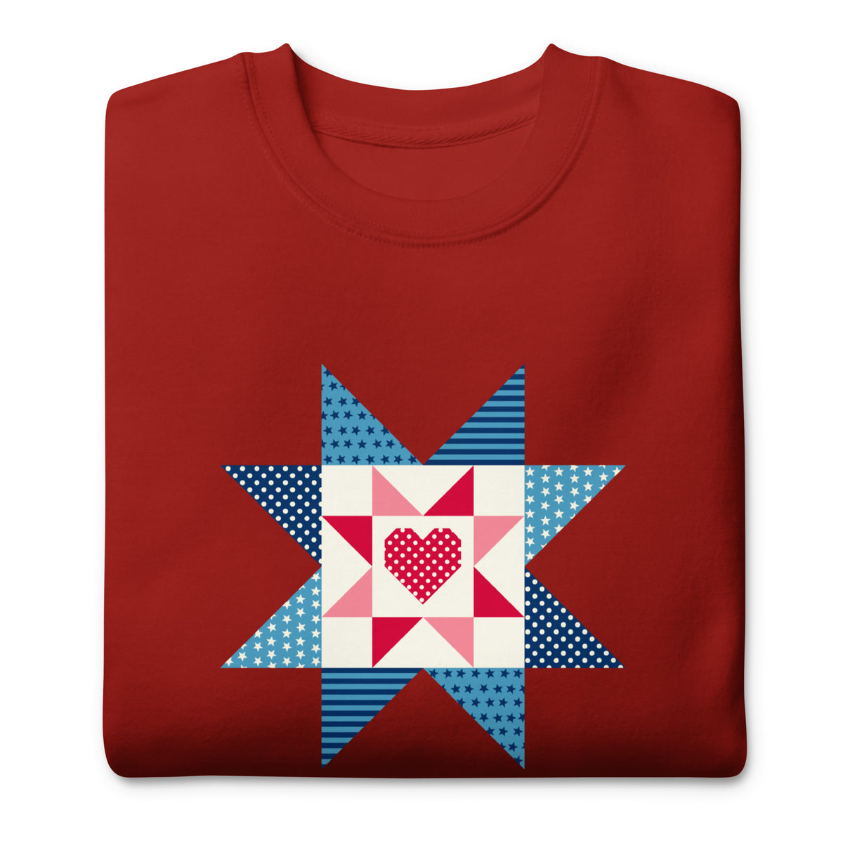 Liberty Love star quilt block with a heart in red, white and blue on a crewneck sweatshirt in cardinal red, folded close-up of the design – Kate Spain design for Pat Sloan