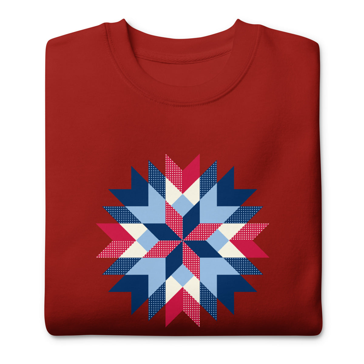 Barn Star quilt block in red, white and blue on a crewneck sweatshirt in cardinal red, folded close-up of the design – Kate Spain design for Pat Sloan