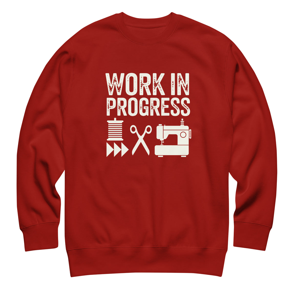 Work in Progress lettering with sewing icons on a premium sweatshirt in cardinal red, front view – Kate Spain design for Pat Sloan