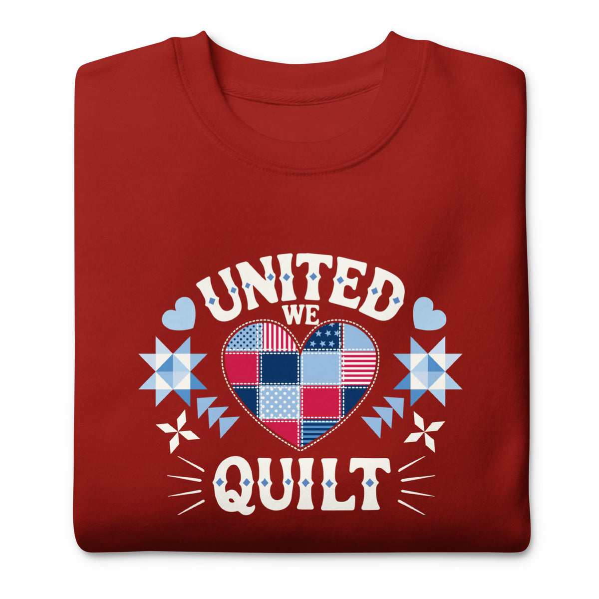 United We Quilt patchwork heart with quilt stars on a premium sweatshirt in cardinal red, folded close-up of the design – Kate Spain design for Pat Sloan