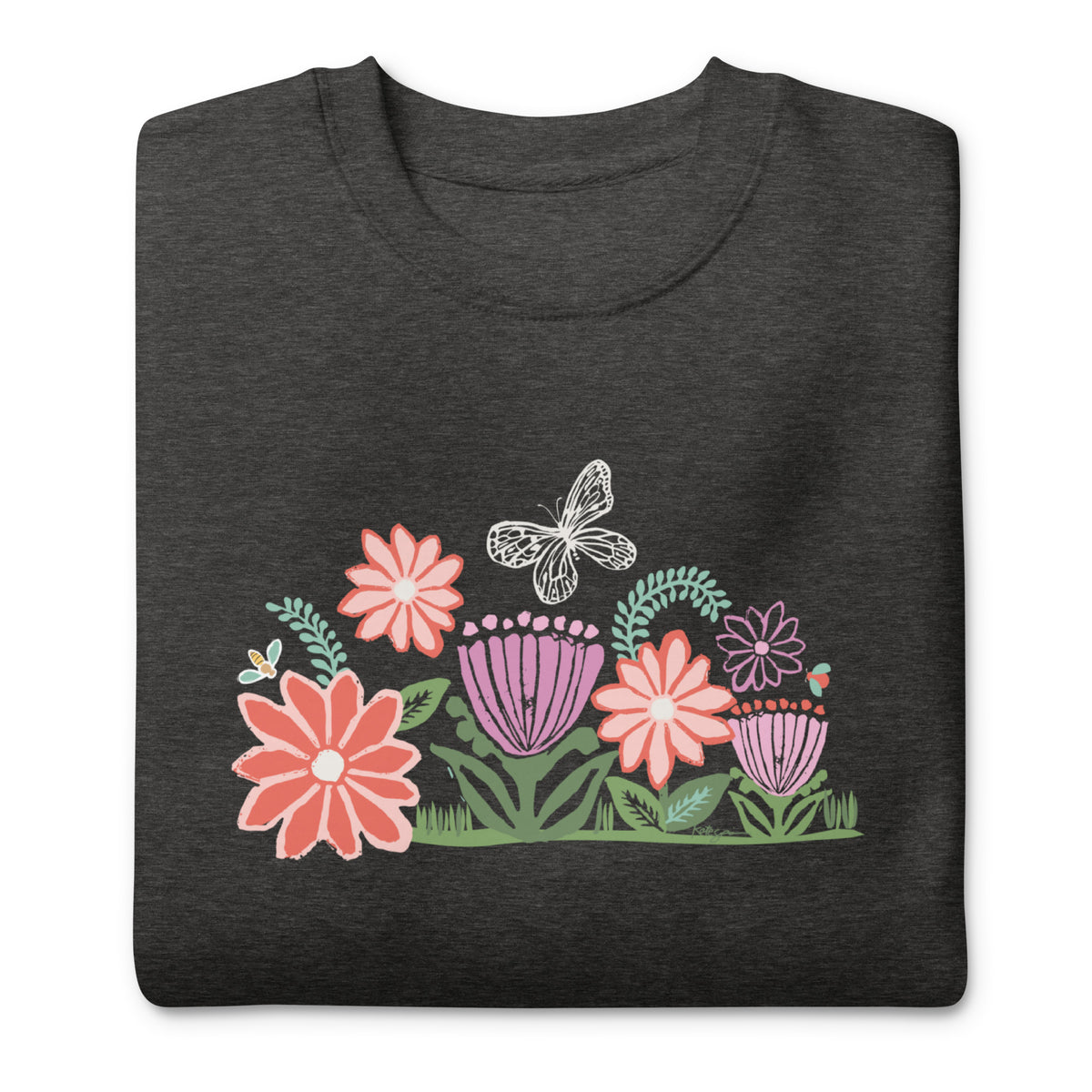Bloom woodblock-style flowers with a butterfly, ladybug and bee on a crewneck sweatshirt in charcoal grey, folded close-up of the design – Kate Spain design