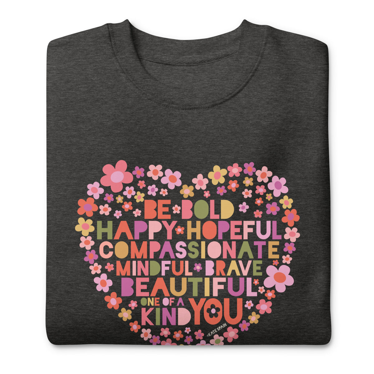 Be You floral heart of inspirational words on a premium sweatshirt in charcoal grey, folded close-up of the design – Kate Spain design