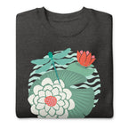 Dragonfly over water lilies and lily pads on a crewneck sweatshirt in charcoal grey, folded close-up of the design – Kate Spain design
