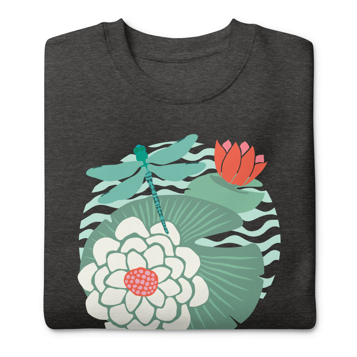 Dragonfly over water lilies and lily pads on a crewneck sweatshirt in charcoal grey, folded close-up of the design – Kate Spain design