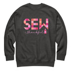 Sew Thankful patchwork lettering with a heart-topped thread spool on a crewneck sweatshirt in charcoal grey, front view – Kate Spain design for Pat Sloan