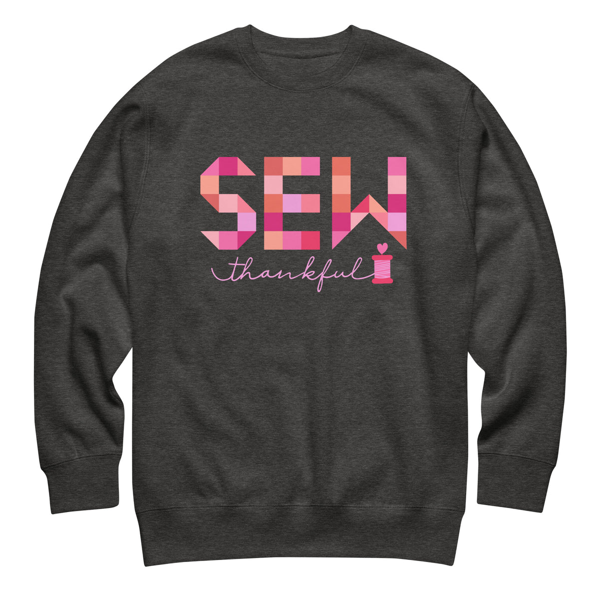 Sew Thankful patchwork lettering with a heart-topped thread spool on a crewneck sweatshirt in charcoal grey, front view – Kate Spain design for Pat Sloan