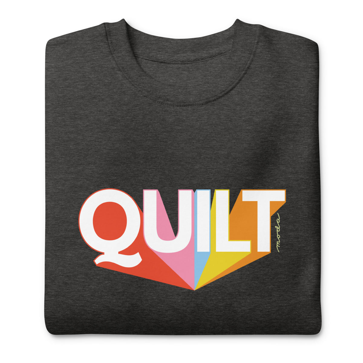 Moda QUILT logo with orange, pink, blue and yellow rays on a premium sweatshirt in charcoal grey, folded close-up of the design – Kate Spain design
