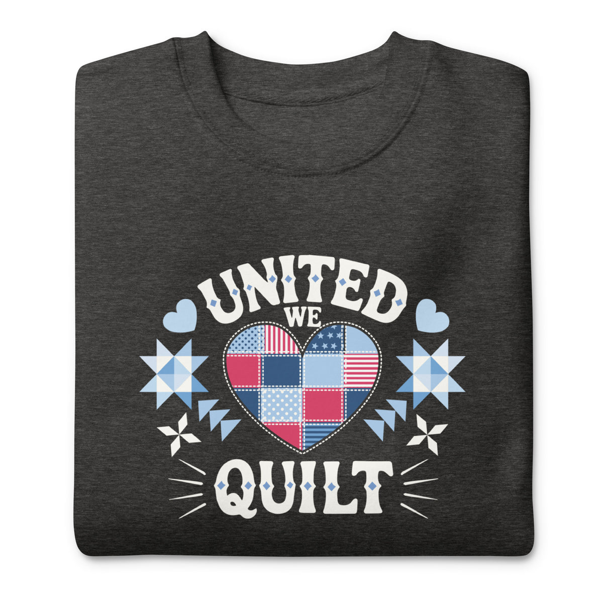 United We Quilt patchwork heart with quilt stars on a premium sweatshirt in charcoal grey, folded close-up of the design – Kate Spain design for Pat Sloan