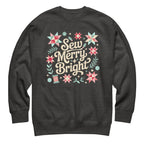 Sew Merry + Bright lettering with quilt stars and holly on a premium sweatshirt in charcoal grey, front view – Kate Spain design for Pat Sloan