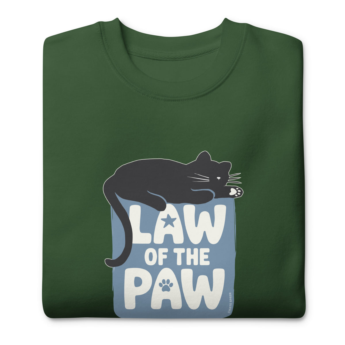 Law of the Paw® design with a cat napping on the logo on a crewneck sweatshirt in forest green, folded close-up of the design – Kate Spain design