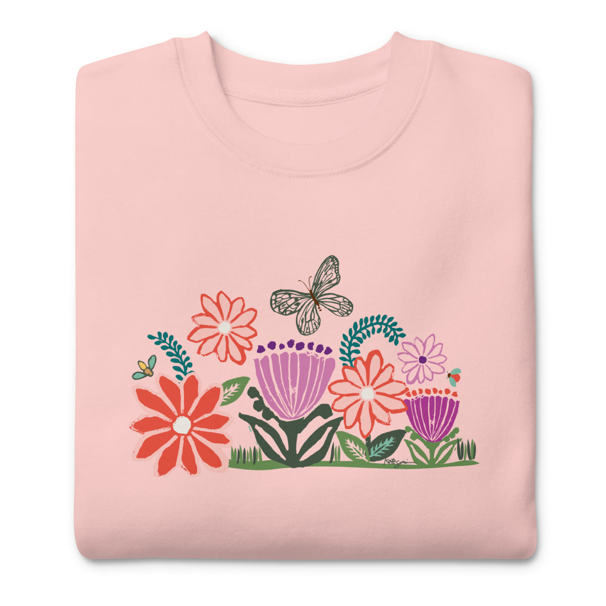 Bloom woodblock-style flowers with a butterfly, ladybug and bee on a crewneck sweatshirt in pink, folded close-up of the design – Kate Spain design