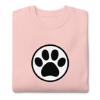 Law of the Paw® cat paw print on a crewneck sweatshirt in pink, folded close-up of the design – Kate Spain design