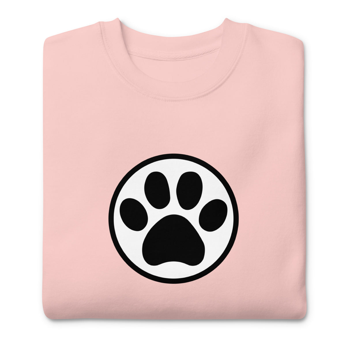 Law of the Paw® cat paw print on a crewneck sweatshirt in pink, folded close-up of the design – Kate Spain design