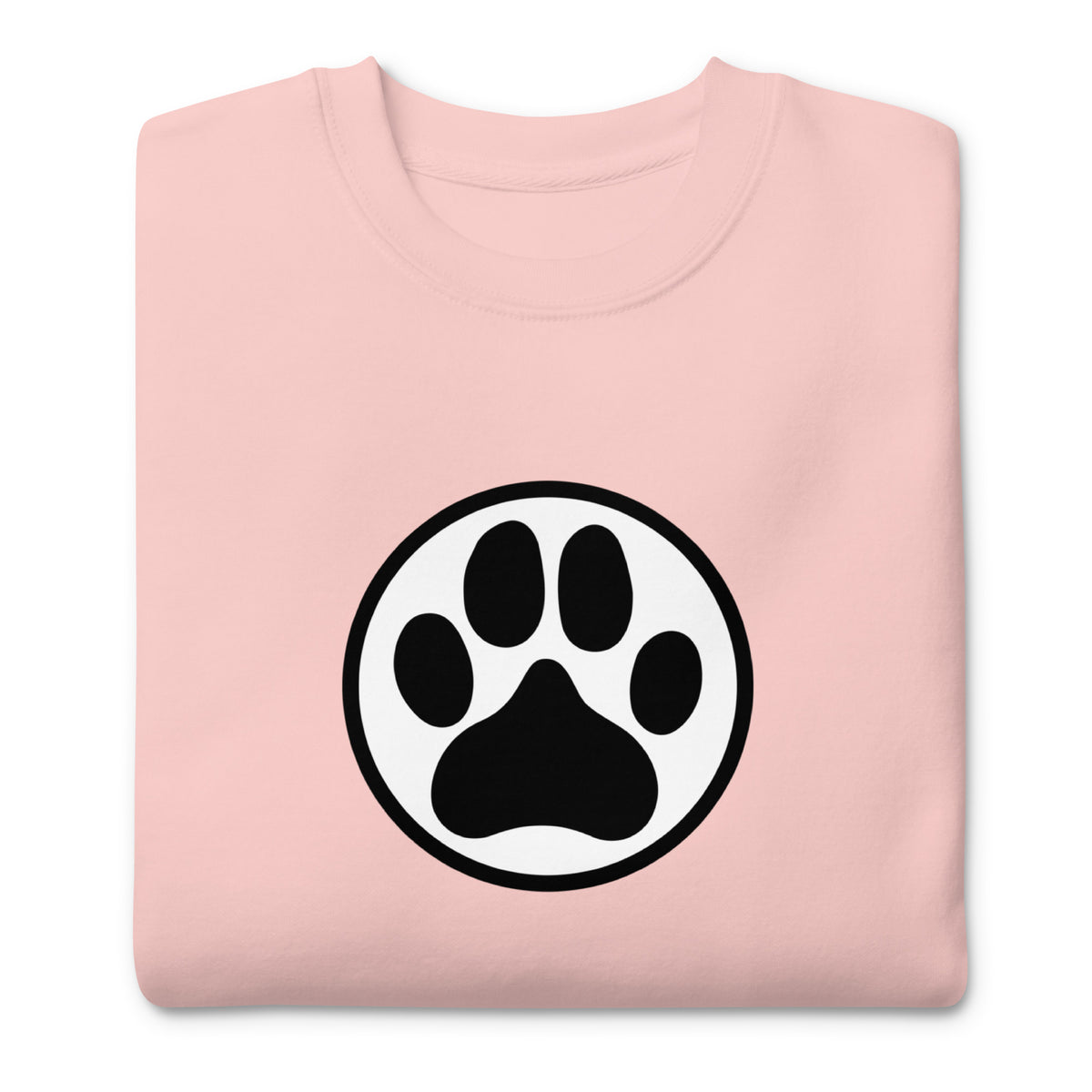 Law of the Paw® dog paw print on a crewneck sweatshirt in pink, folded close-up of the design – Kate Spain design
