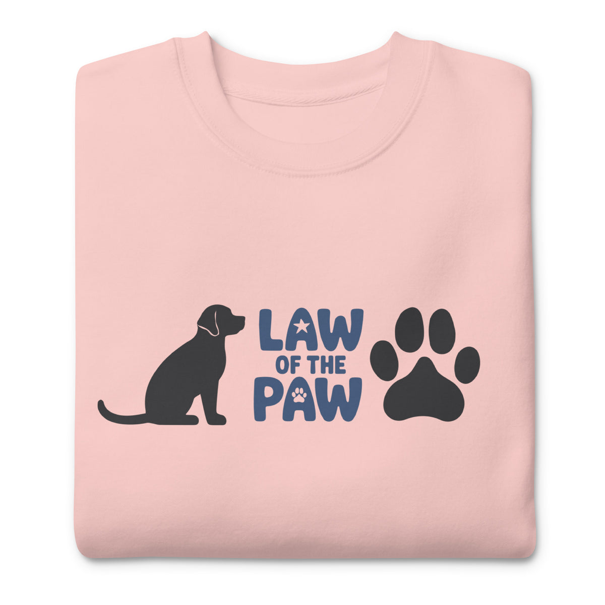 Law of the Paw® logo with seated dog and paw print on a crewneck sweatshirt in pink, folded close-up of the design – Kate Spain design